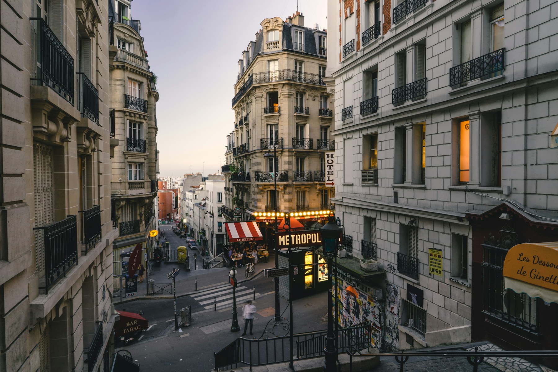 A Haussmann-era Paris street and café on a French immersion trip