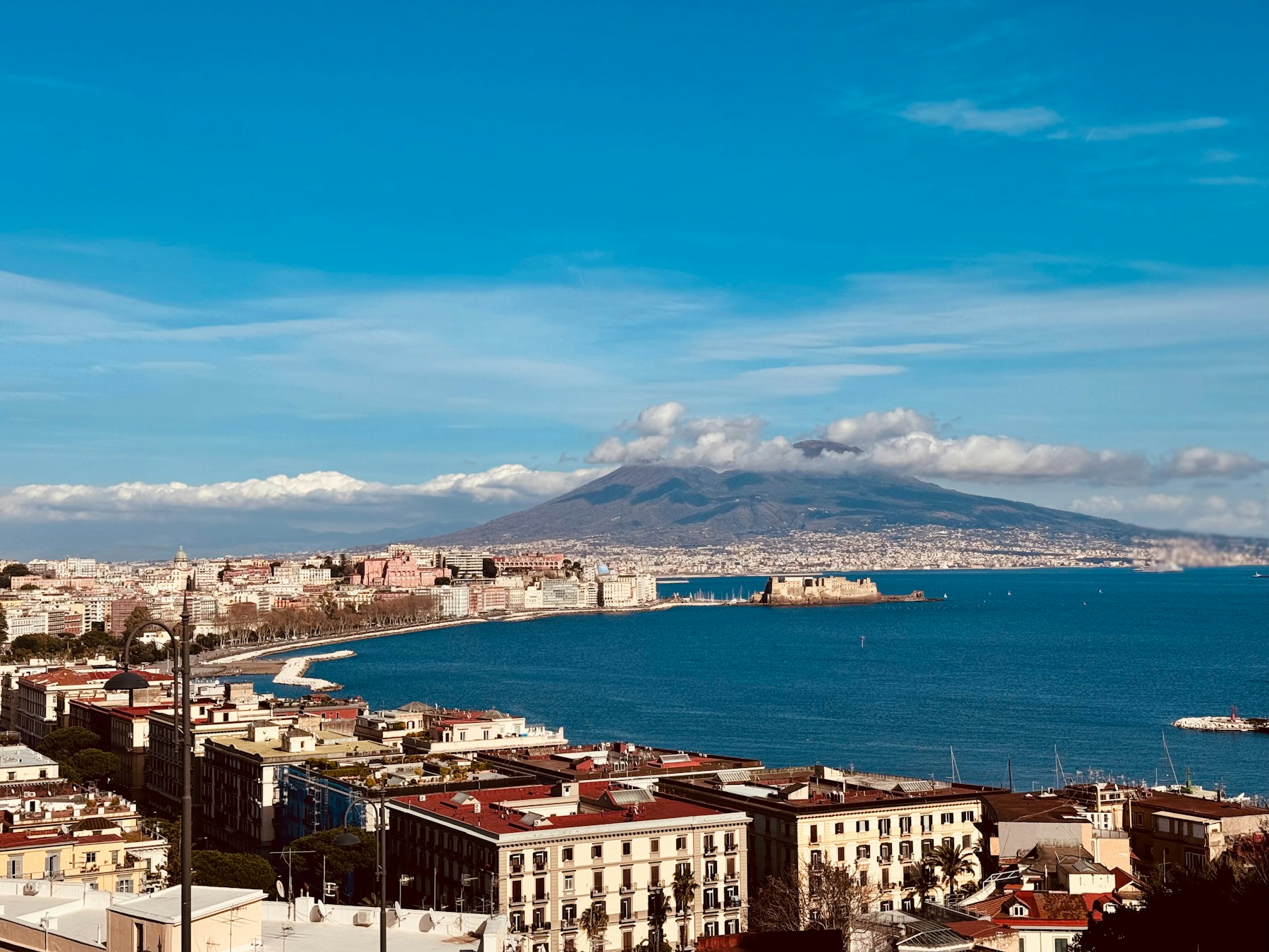 Vesuvius rising over the Bay of Naples and the historic city centre on an Italian school trip