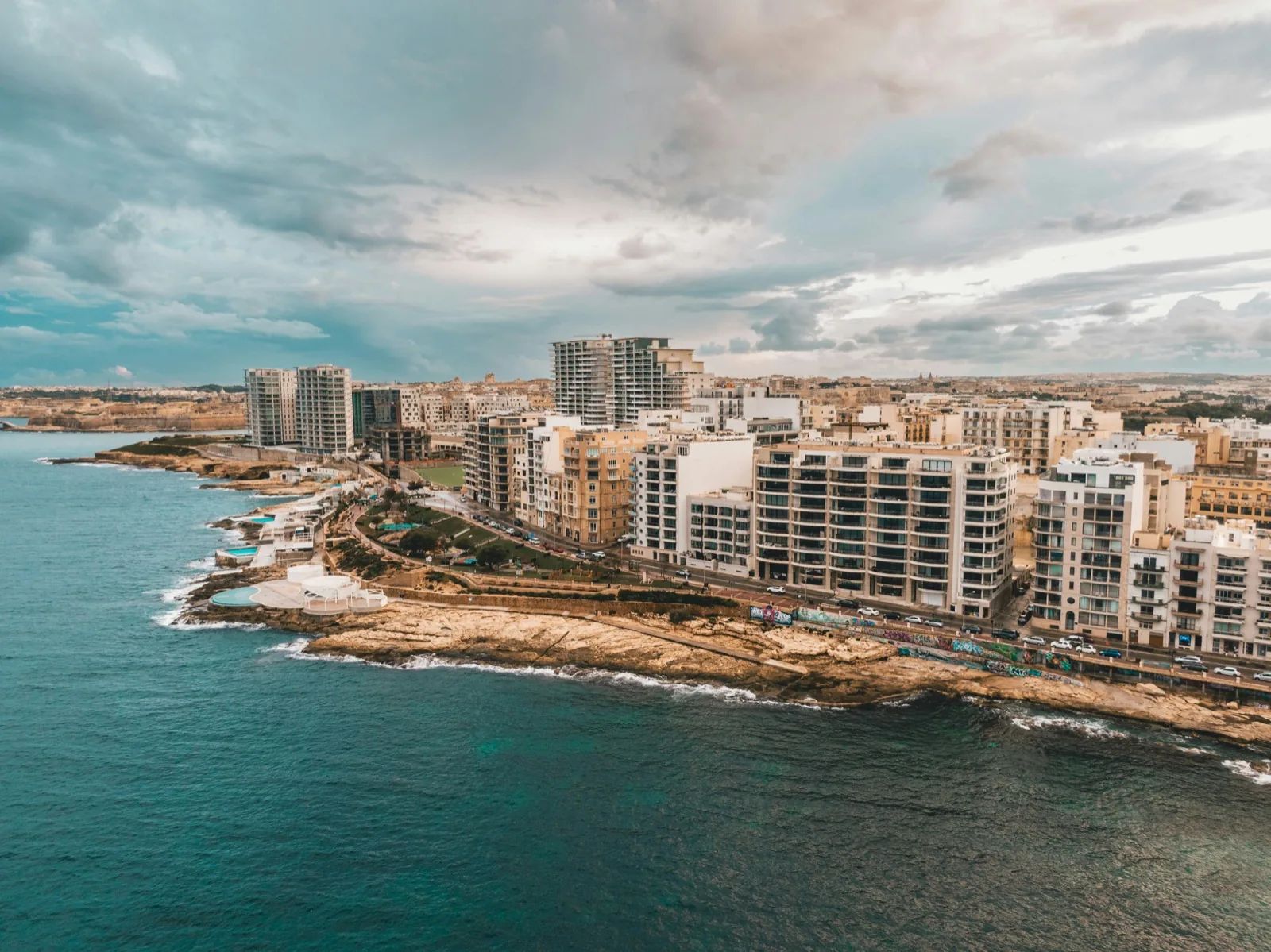 Sliema seafront promenade with views of Valletta during a language stay in Sliema, Malta